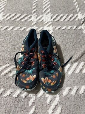 Nike Women's Navy Floral Athletic Sneakers with Orange Accents